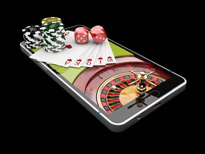 Filipino player using the 99ph app on a smartphone to access sports betting and casino games